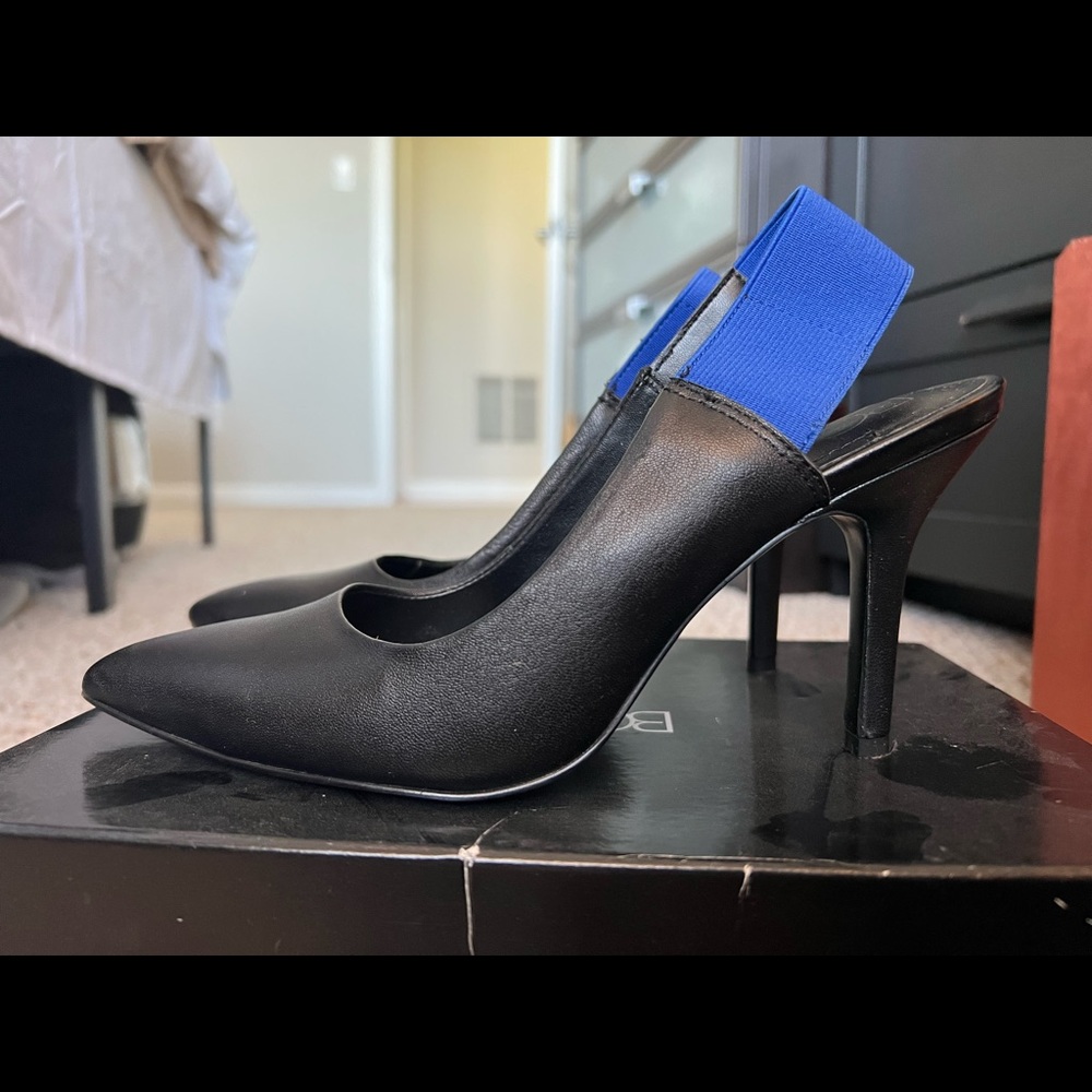 Black pointed toe heels with blue strap detail